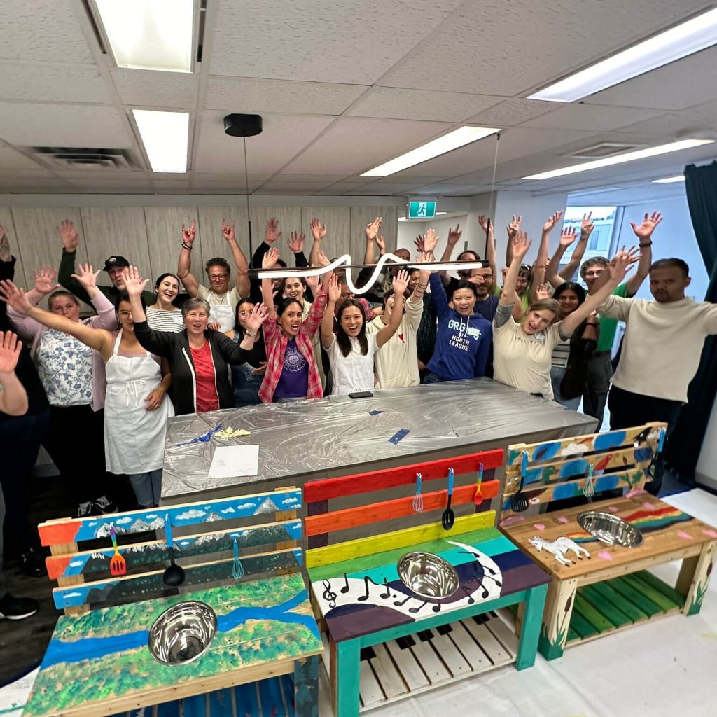 Group celebrating behind finished benches