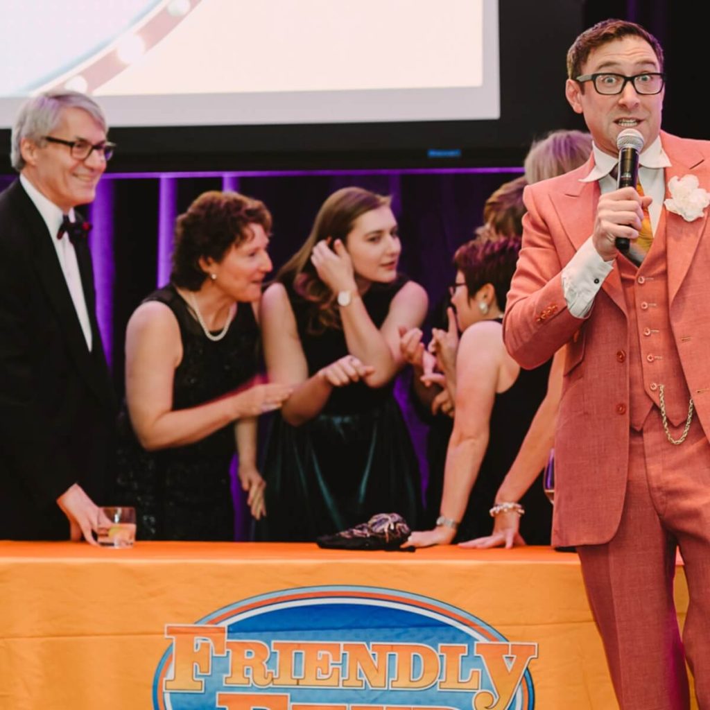 Family Feud stage moment — teams competing