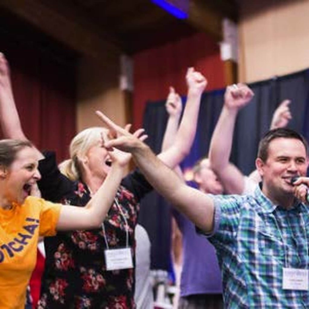 name-that-tune-music-trivia-corporate-event-crowd-standing-cheering