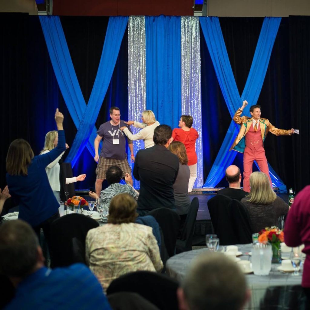 name-that-tune-music-trivia-corporate-event-on-stage