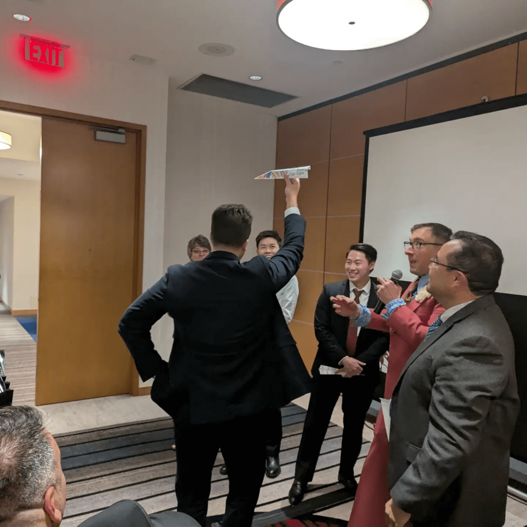 pop-trivia-team-building-corporate-event-man-holding-an-airplane